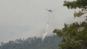 Köyceğiz yangınına 12 helikopter ve 2 uçak ile müdahale sürüyor